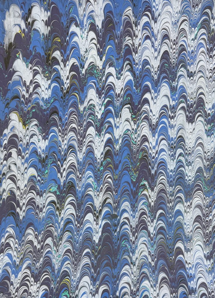 Gap tooth pattern in shades of blue, white, purple, teal and yellow.