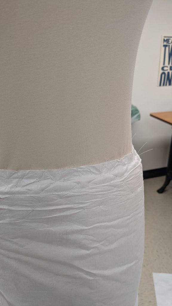 Close up of tyvek and felt skirt showing zig zag stitch.